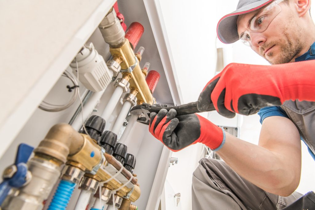 A technician fixing a valve